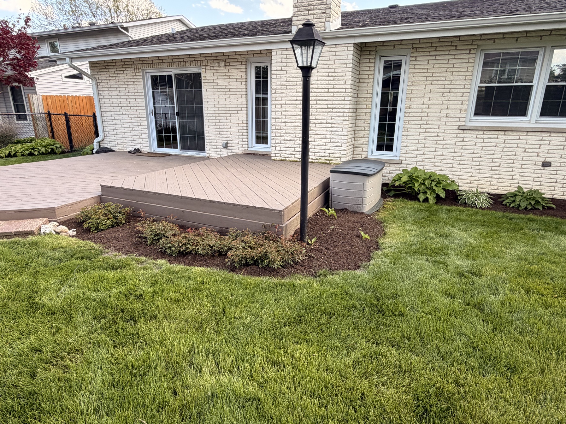 Deck-edge planting bed and lawn restore