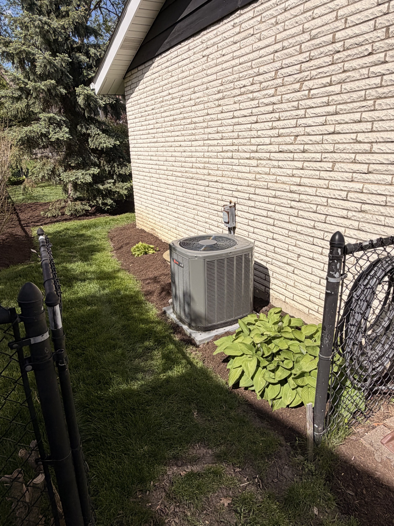AC-side mulch and planting cleanup